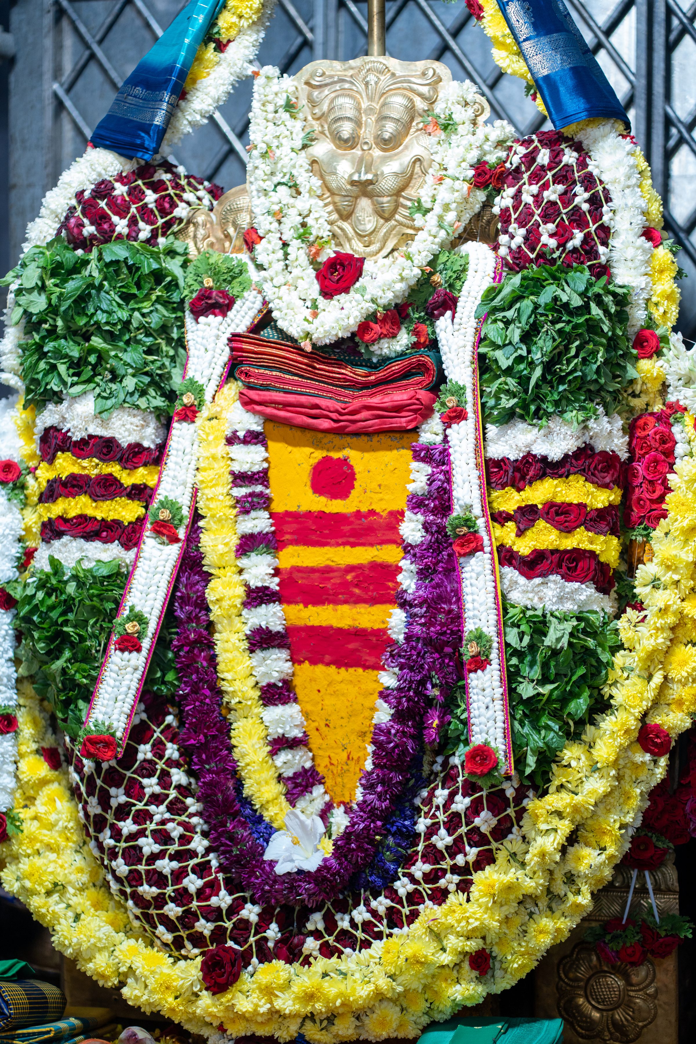 Decorative floral deity ornament at a Griha Pravesha housewarming ceremony
