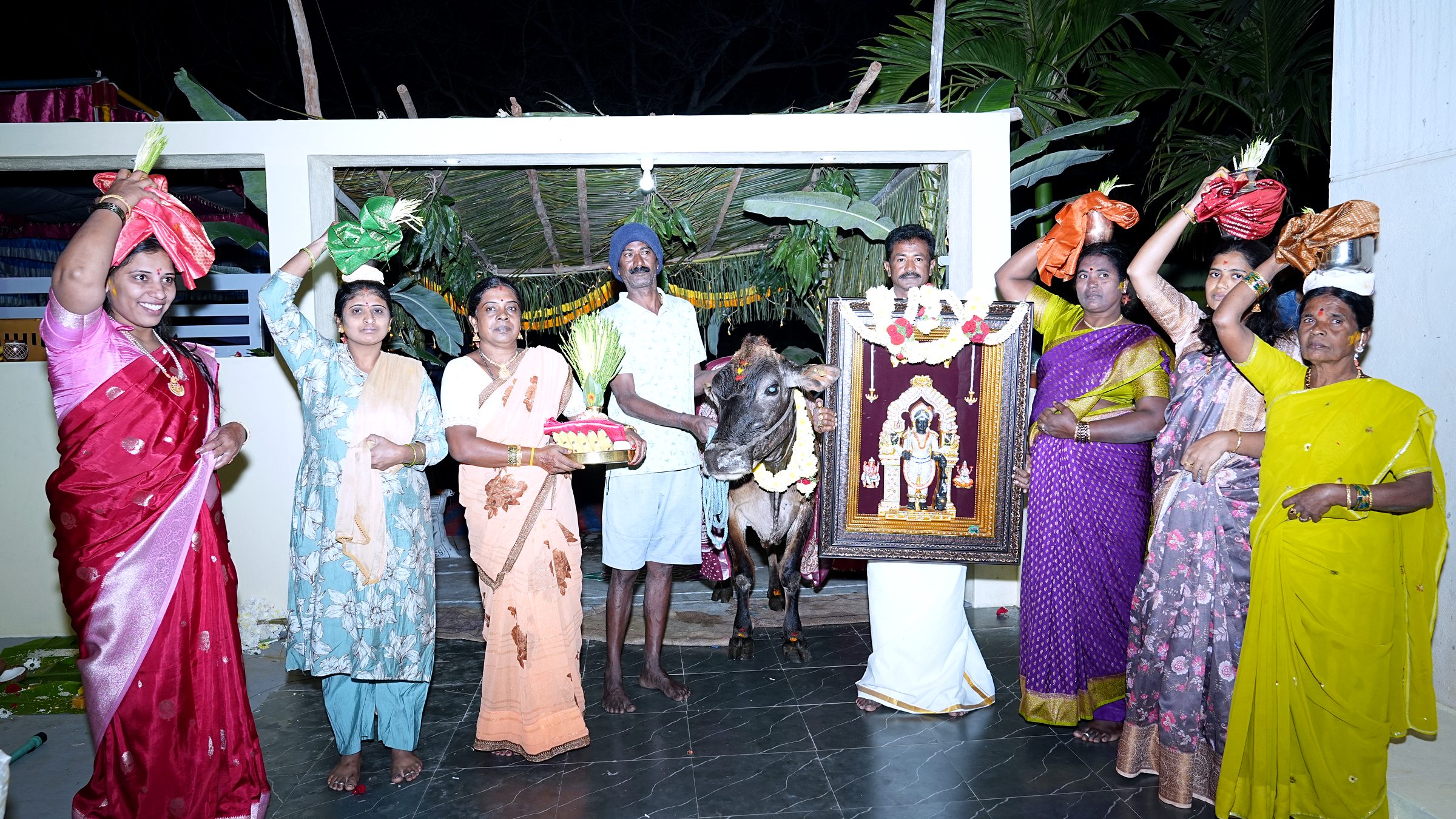 Candid family moment captured during a Griha Pravesha ceremony by Lumeora Studios