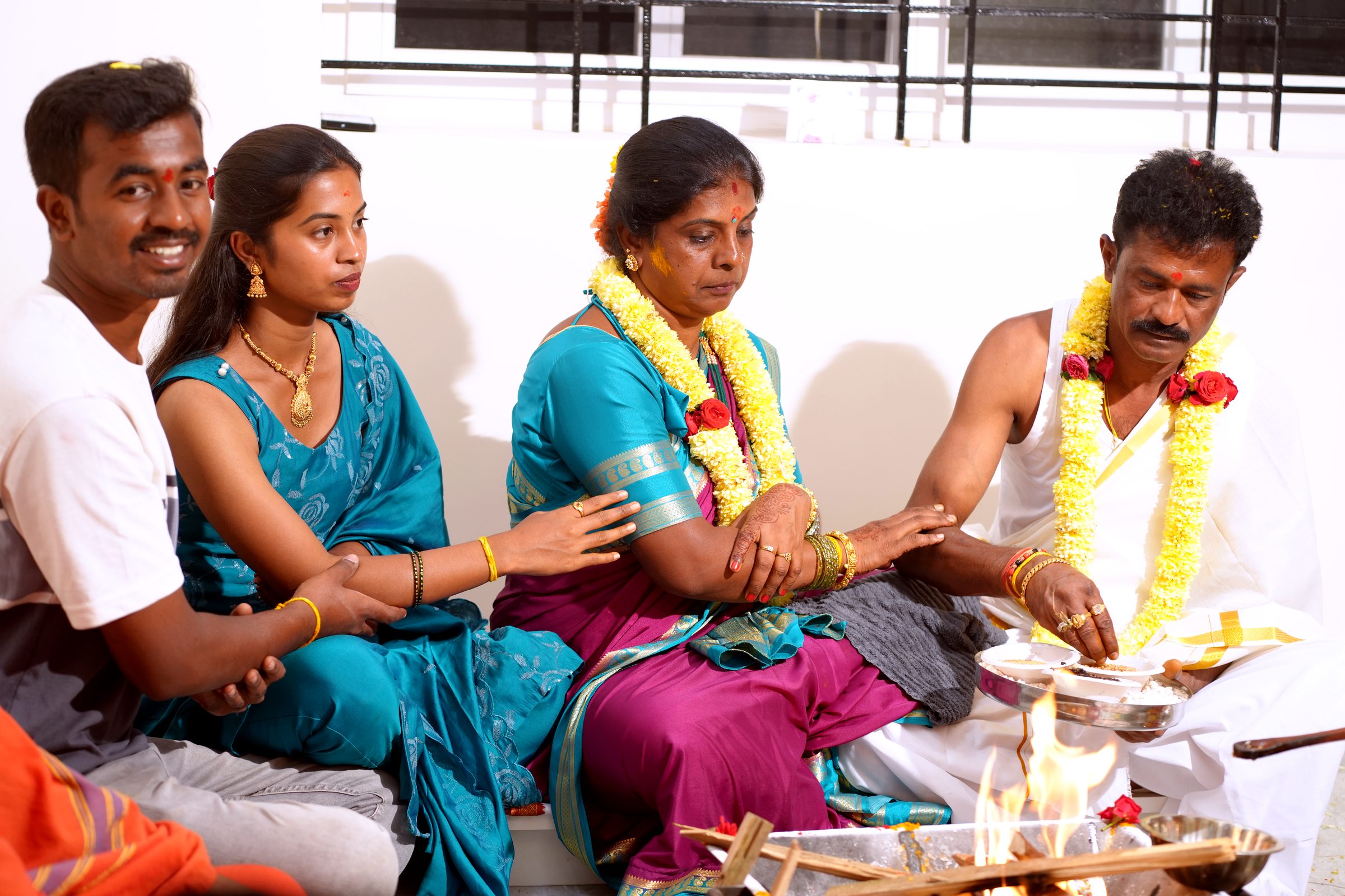Candid family moment during the housewarming ritual