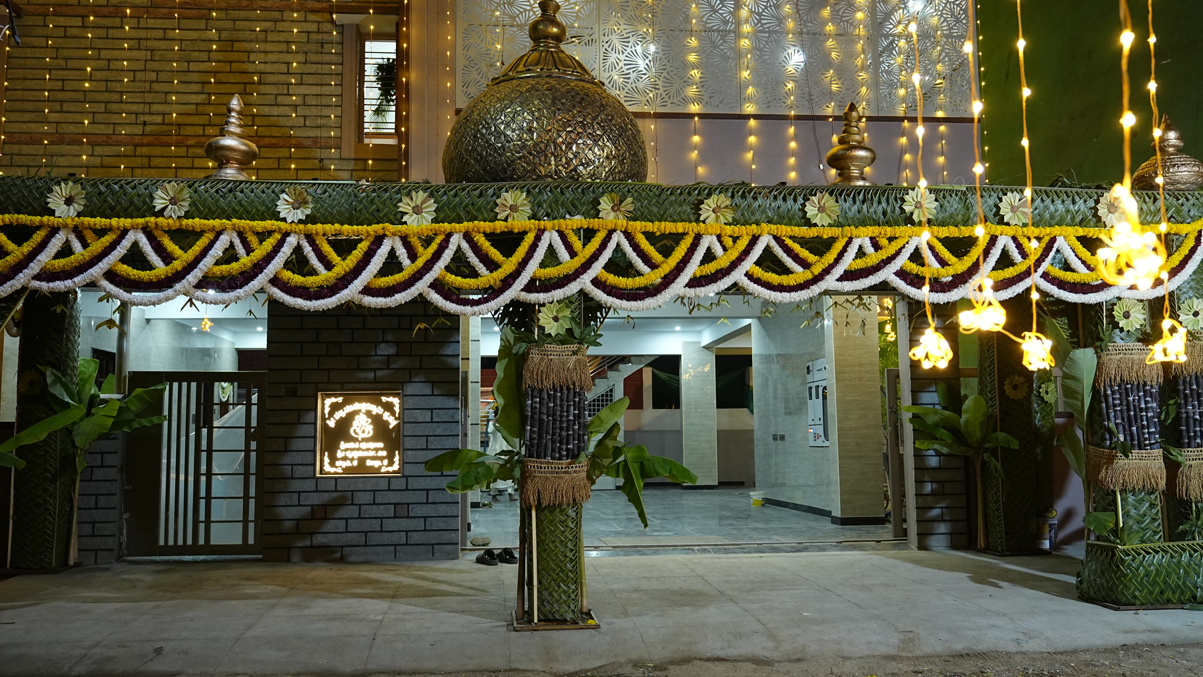 Decorated entrance for a Griha Pravesha housewarming ceremony in Bangalore by Lumeora Studios