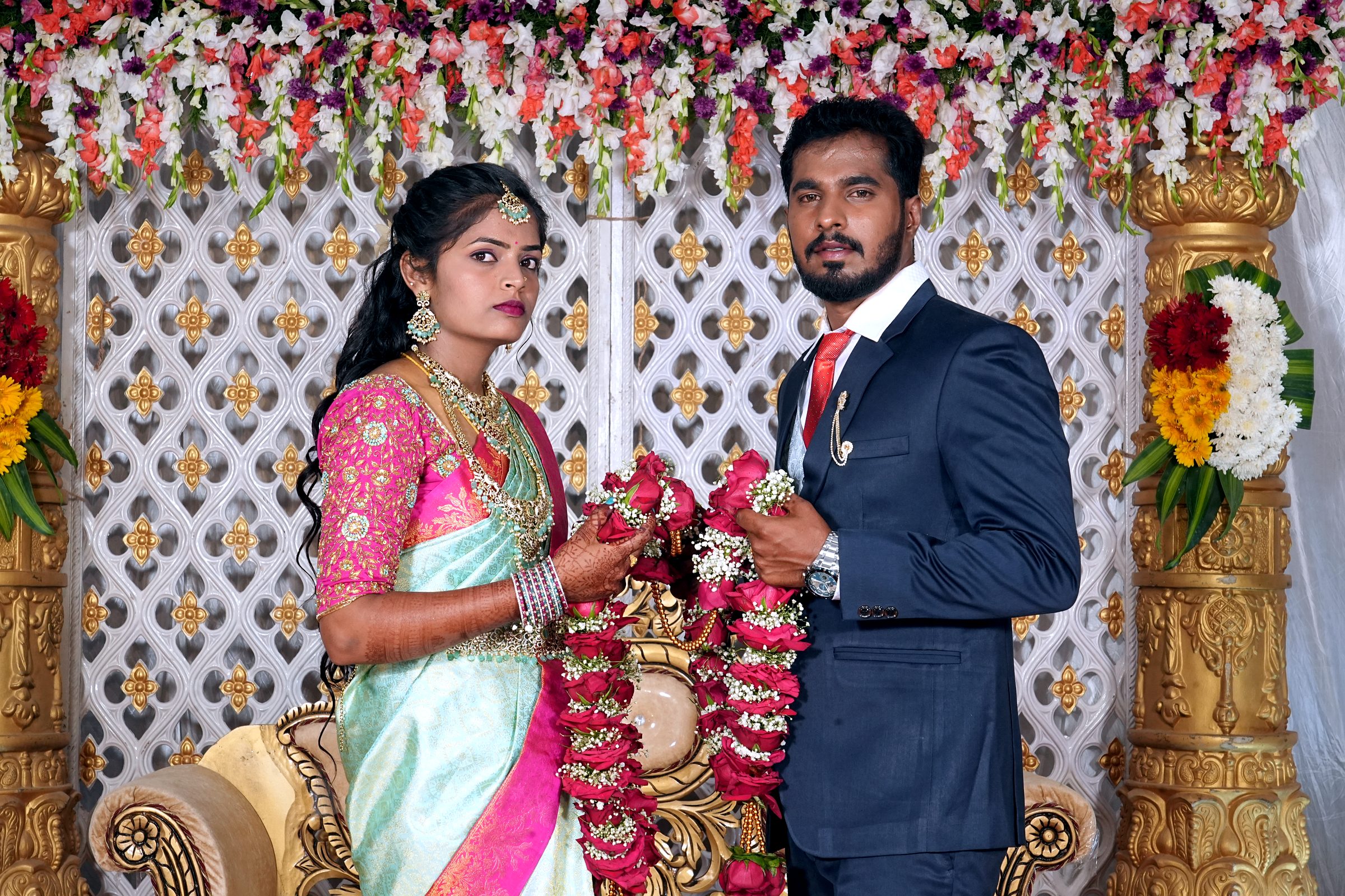 Candid couple portrait with garlands during a traditional Karnataka wedding