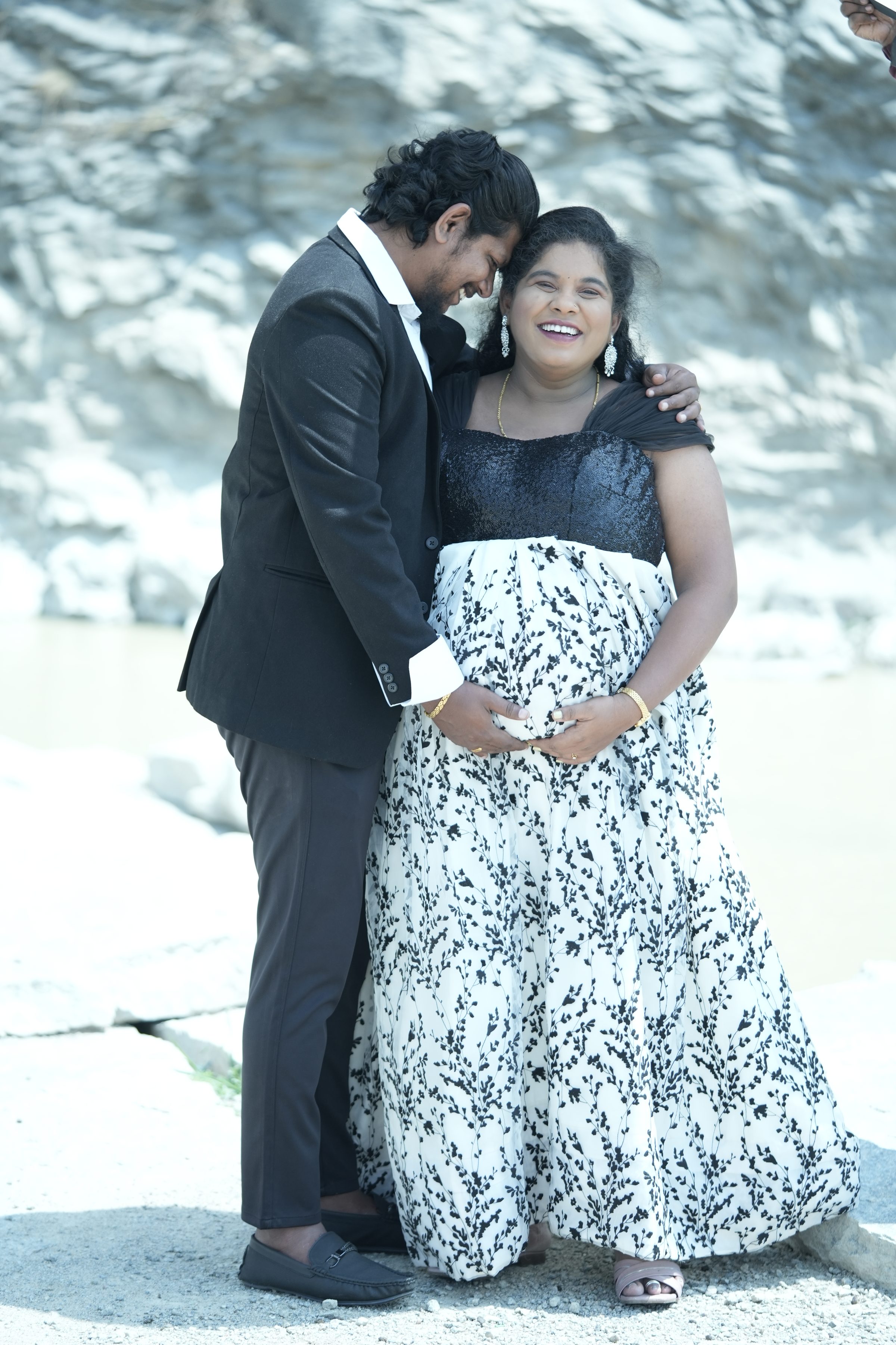 Couple embracing during an outdoor portrait session by Lumeora Studios