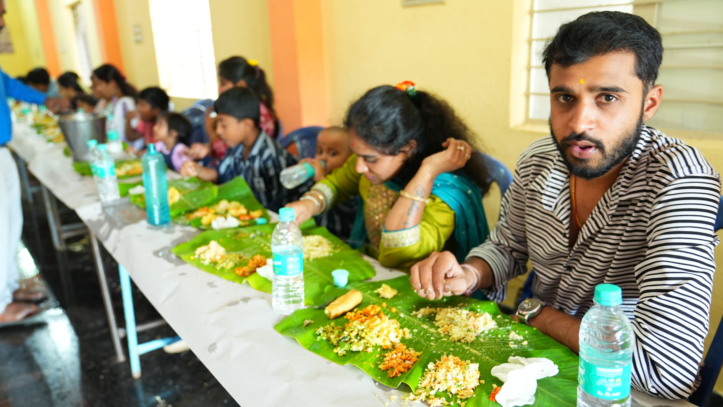 Naming ceremony decorations and family in Bangalore