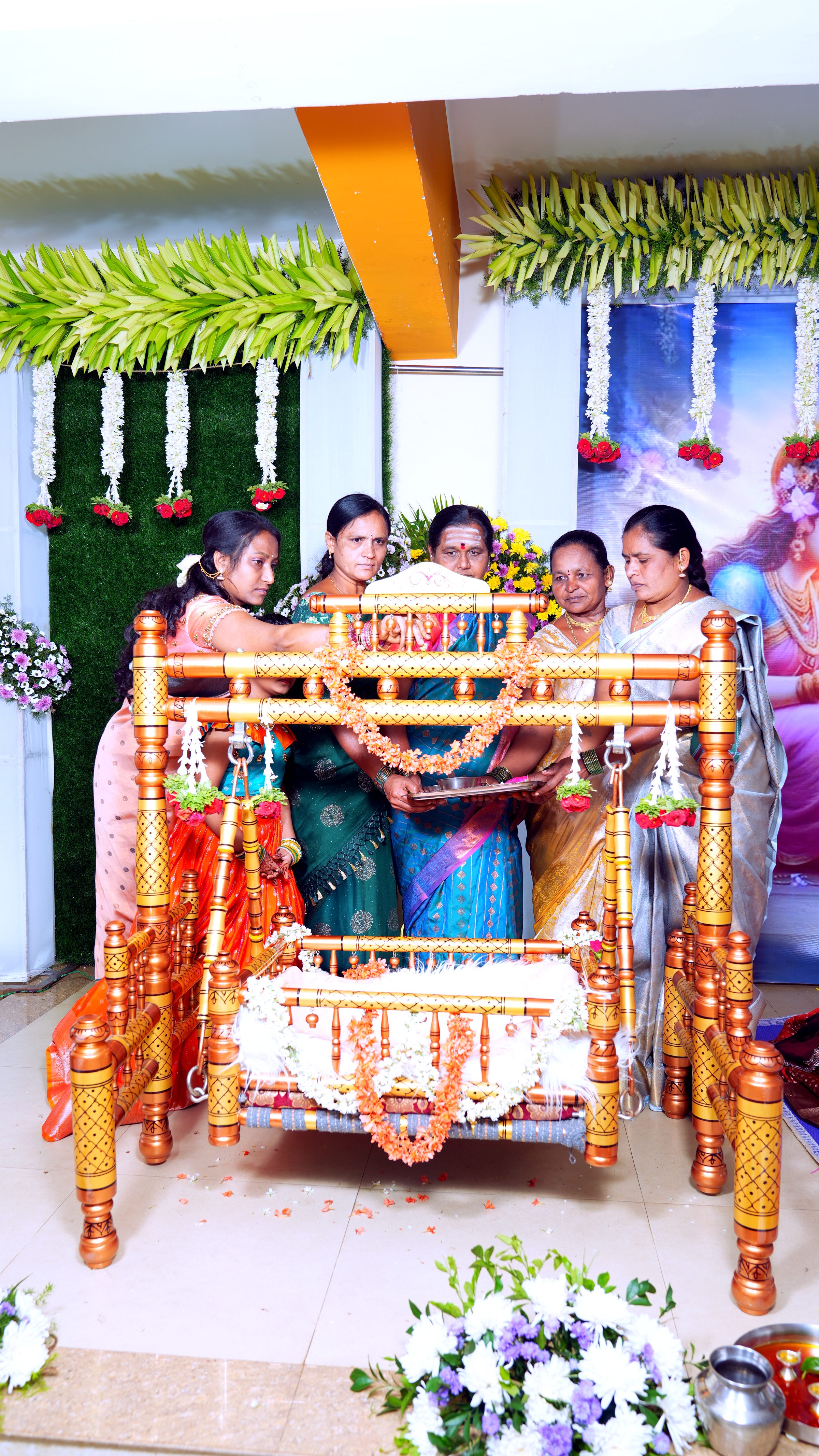 Decorated ceremonial cradle for a naming ceremony in Bangalore