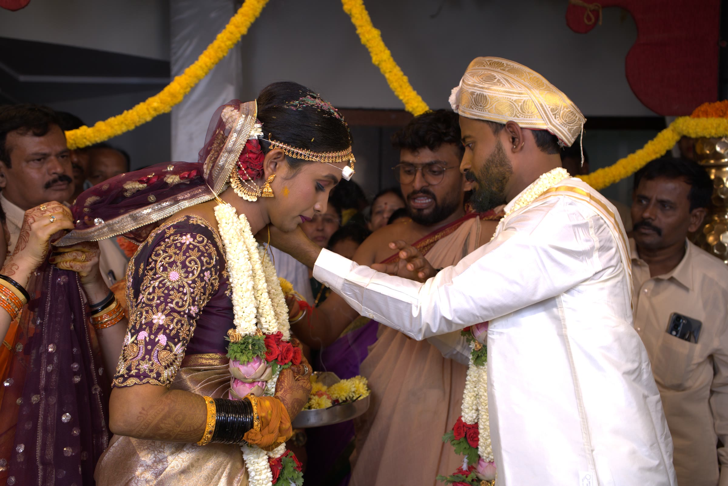 Bride and groom during a wedding ritual, captured by Lumeora Studios in Bangalore